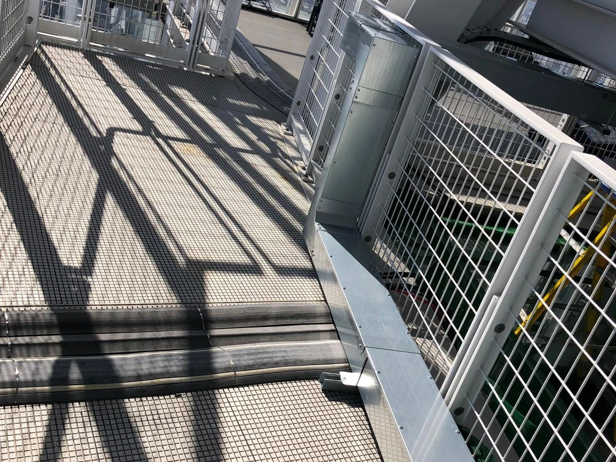 Steel mesh walkway and balustrade on a high-level plant platform