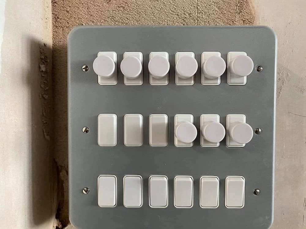Metal-clad dimmer and switch plate with three rows of six controls