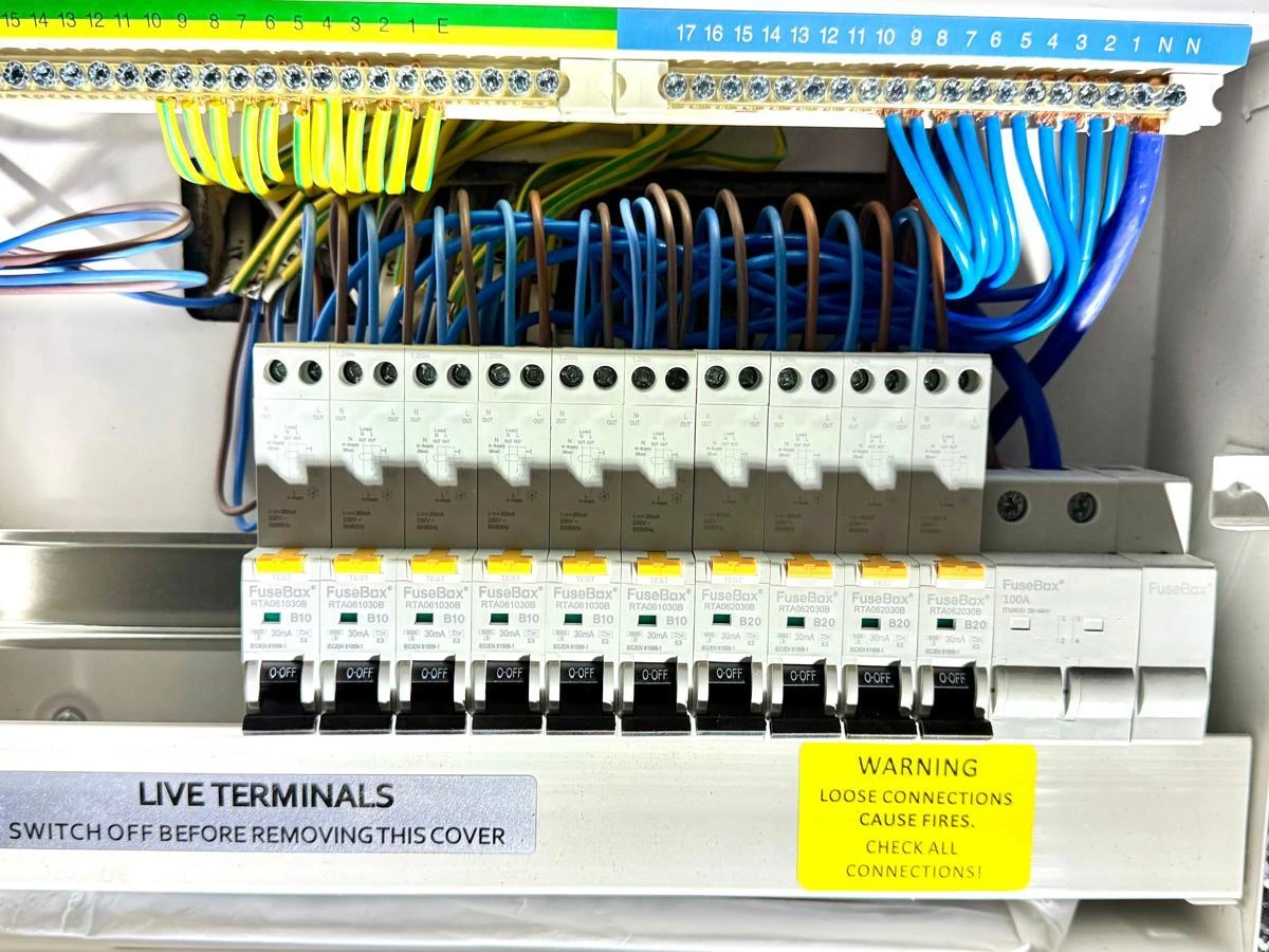 Consumer unit with new circuit breakers, RCDs and wiring tidied inside the enclosure
